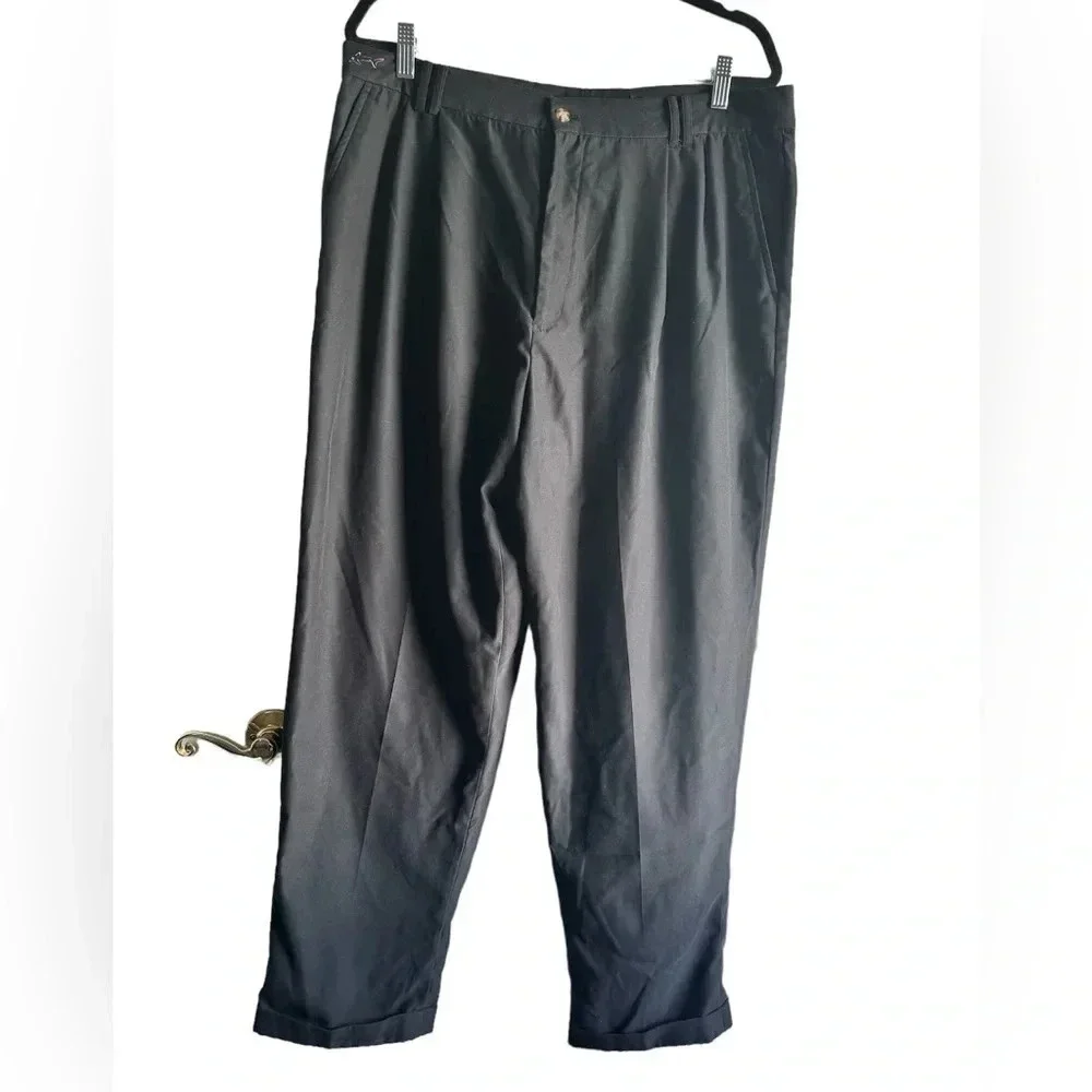 Greg Norman black, pleated golf slacks with a cuff.  Size 38x30